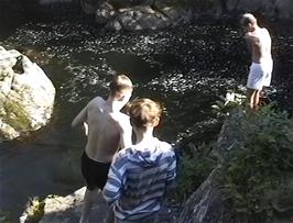 The aquatic members of the group jumping into the cool water of the River Llugwy at Pont-y-Pair Bridge, Betws-y-Coed
